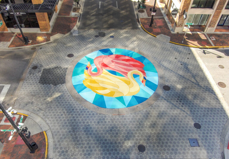 Tapestry Downtown Orlando Intersection Mural A Pivotal Character Artworks artworks mural muralist hand painted signage fabrication custom intersection pride florida desantis fdot transportation bloomberg foundation traffic safety district crosswalk swan Orlando Gym Signage Mural muralist Florida Street Art Fabrication Signage Graffiti Painting SEESKIP Charity Public Art Hire Professional Nashville Miami Tampa St Petersburg Artist Hire Pride Rainbow